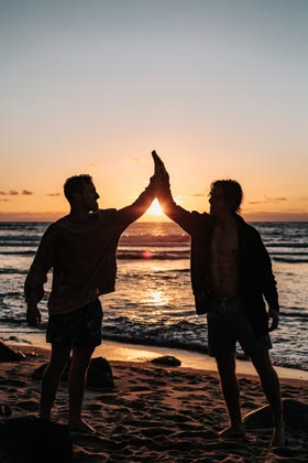 Two Male Friends at the ocean during sunset