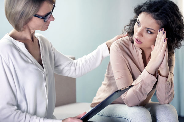 Young female client during a consultation with a therapist