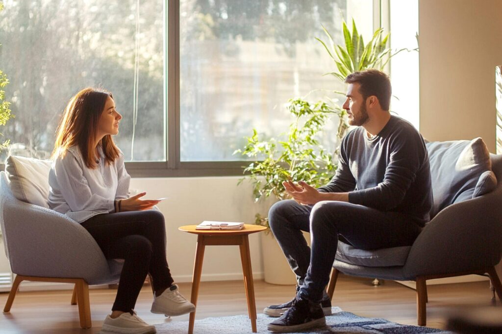 A therapist talking to a client while in rehab for professionals