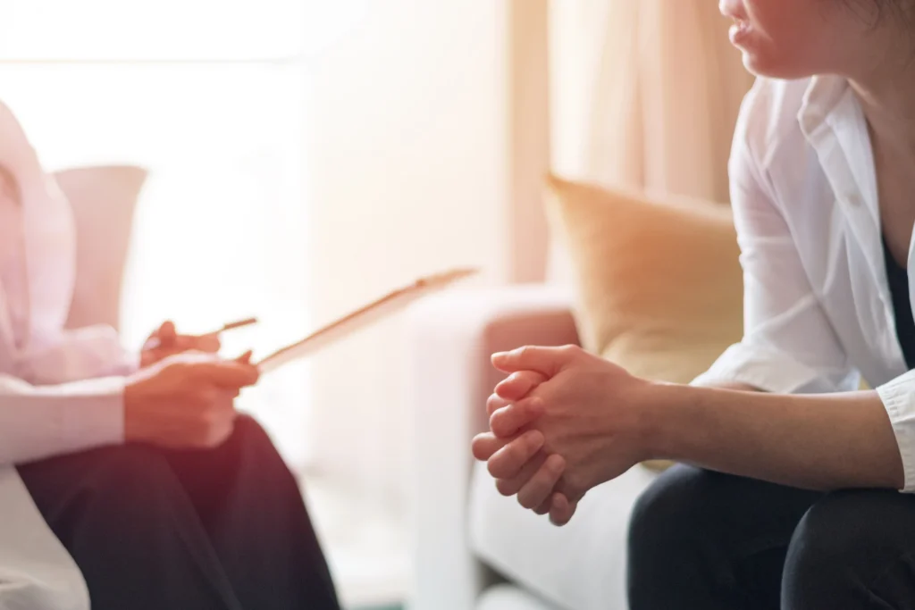 Professional receiving support for drug and alcohol addiction treatment.